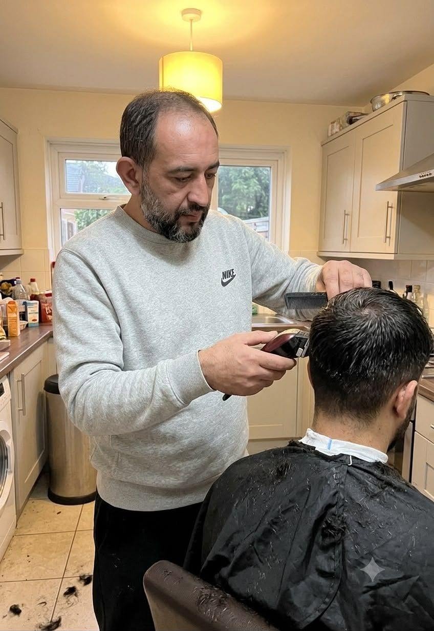 Fahrettin cutting a client's hair at a home visit
