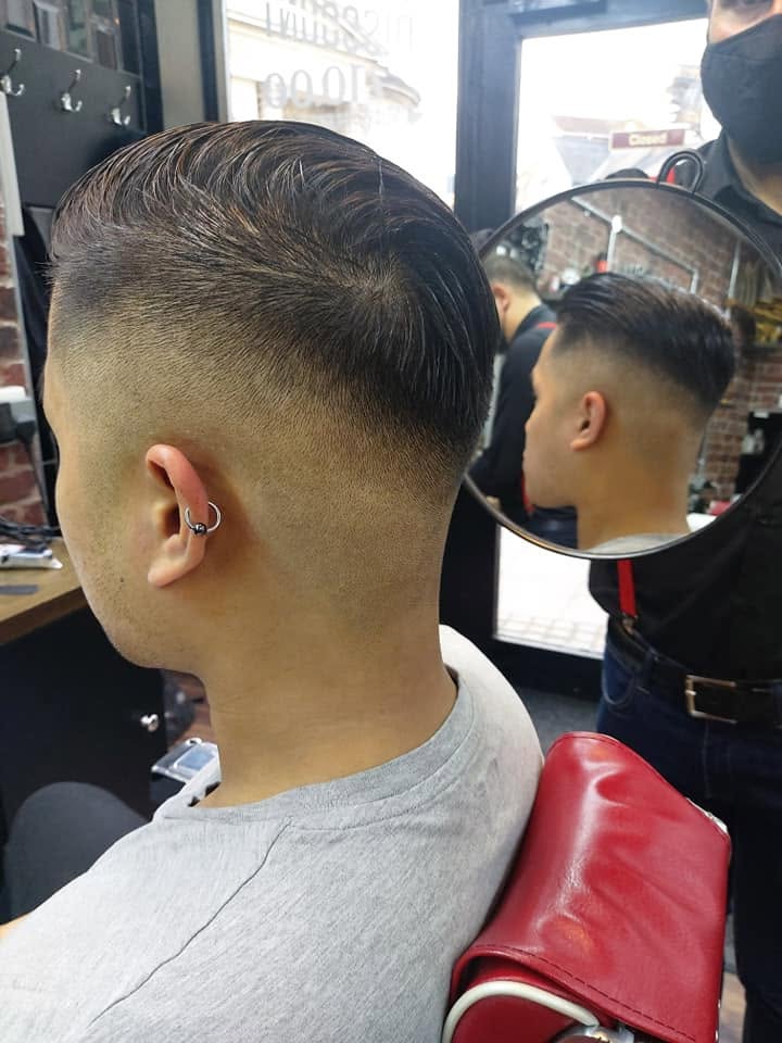 Slicked-back fade finished by Fahrettin