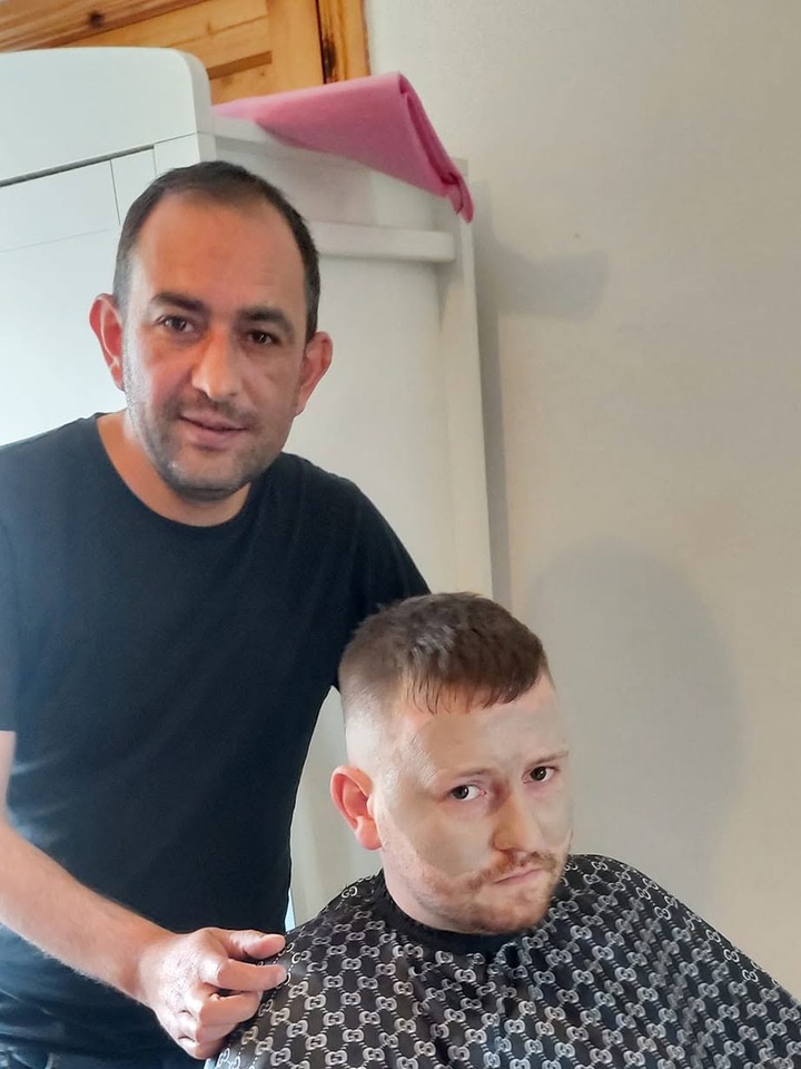 Fahrettin with a client after a fresh cut